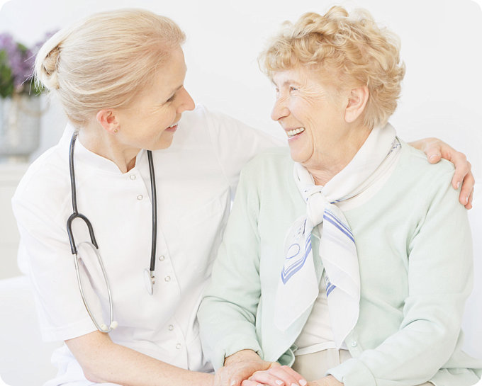 smiling nurse and old woman