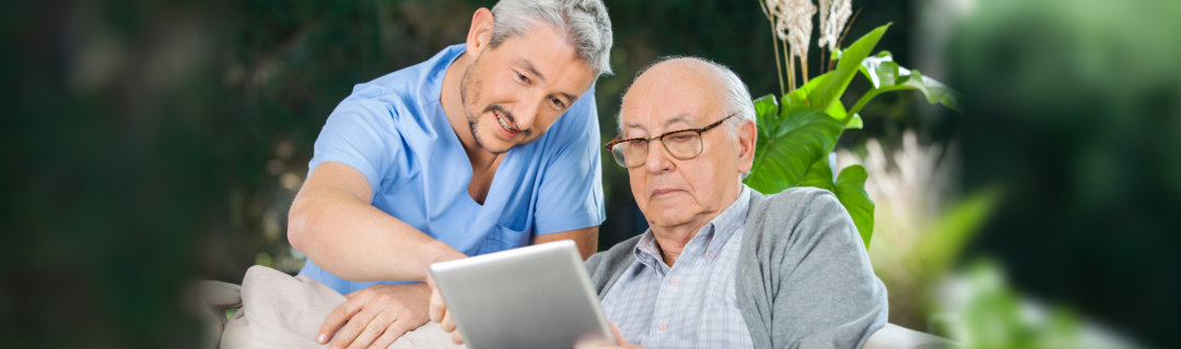 old man using a tablet
